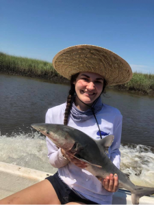 student holding fish