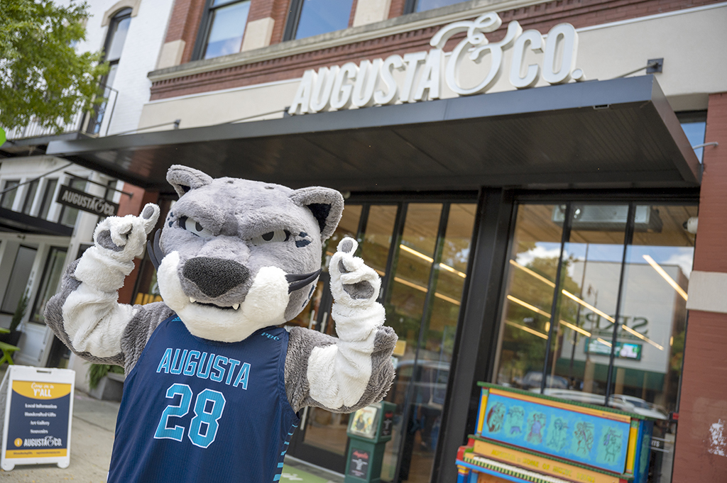 Mascot in front of store