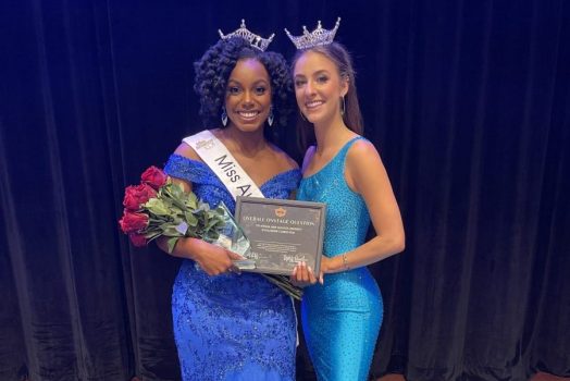 two women wearing blue dresses and crowns