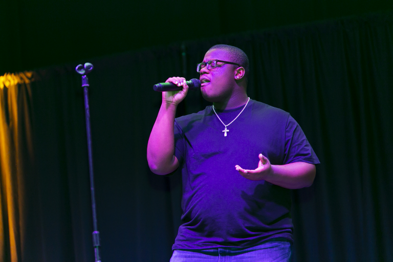 man singing into a microphone