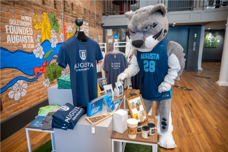 mascot looking at clothes