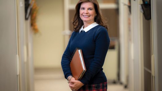 woman in blue shirt smiling