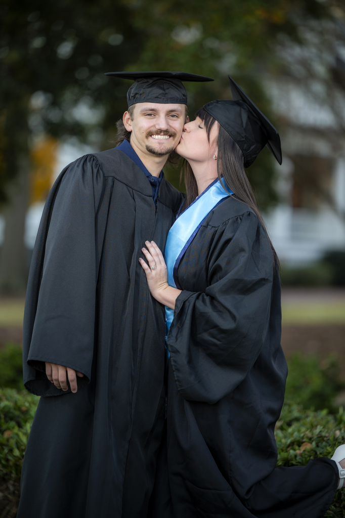 man and woman in graduation gowns