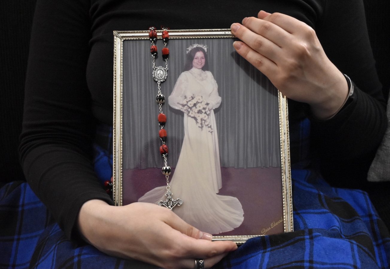 woman holding photo of her mother