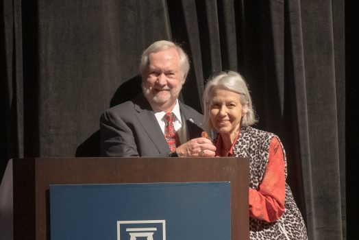 man and woman at podium