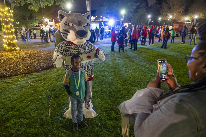 Augusta University mascot taking photo with a child