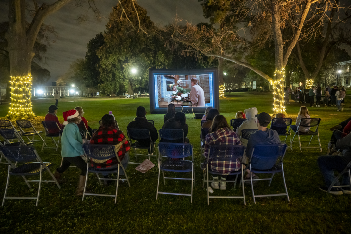 a group of people watching the movie "Elf"