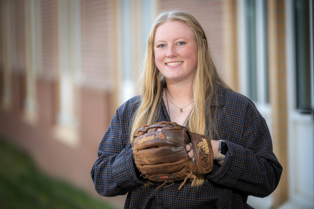 woman wearing softball mitt