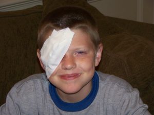 Boy with patch on eye
