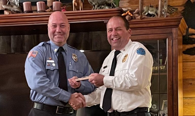 Man being given an awardd