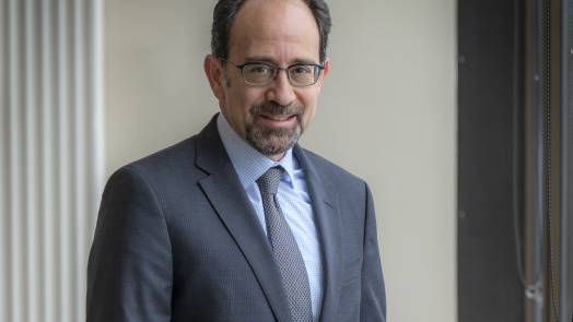 man in blue suit and glasses