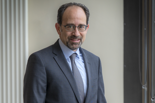 man in blue suit and glasses