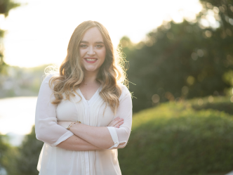woman in white shirt standing outside