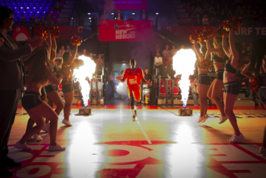 man running on basketball court