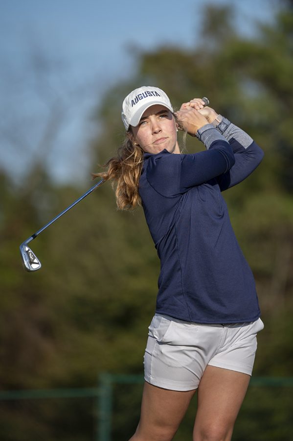 Woman golfing