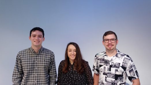 three people against a grey background