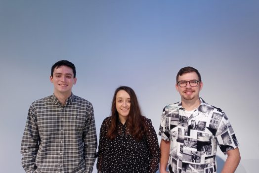 three people against a grey background