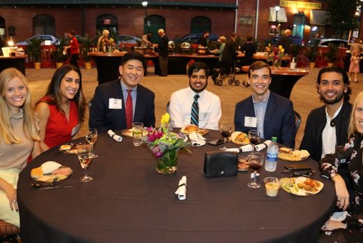 7 people seated at dinner table