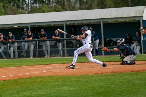 baseball player swinging bat