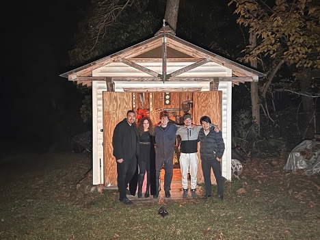 cast and crew posing for a film after ad wrap up.