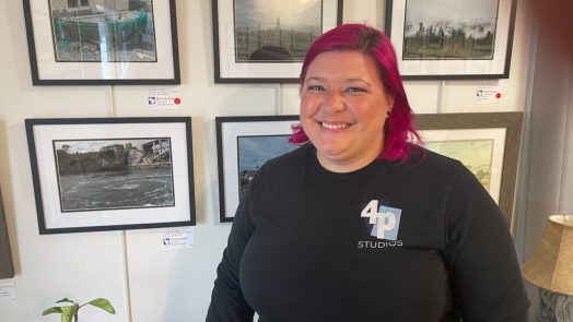 Woman standing in front of art