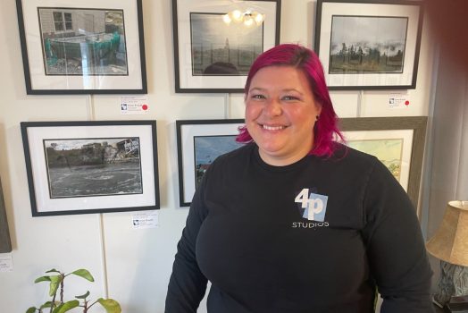 Woman standing in front of art