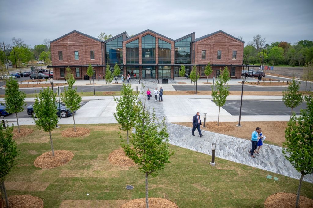 People outside a new building