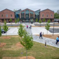 People outside a new building