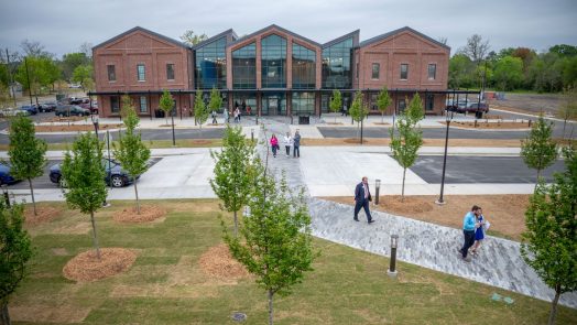 People outside a new building