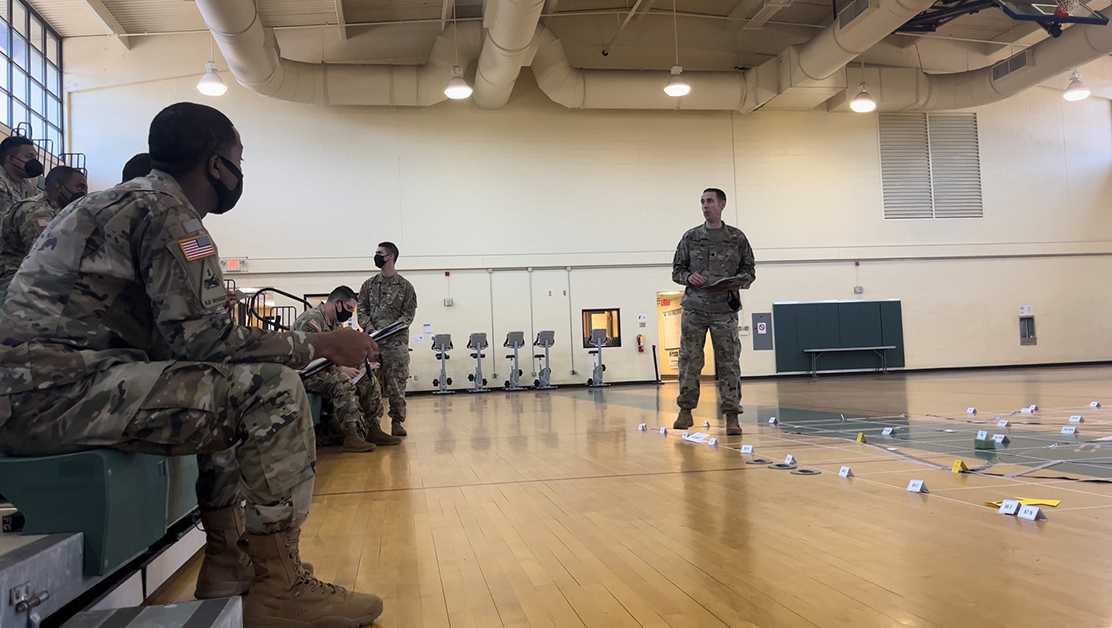 Man talking with soldiers