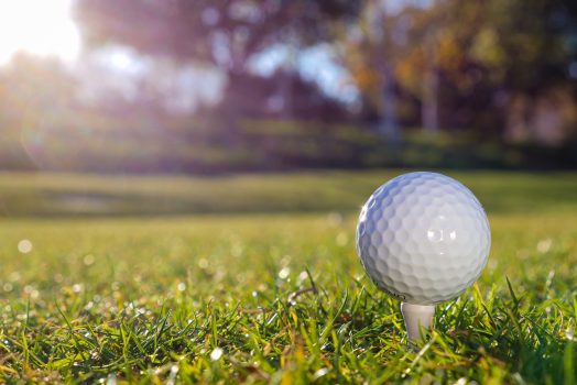 a golf ball sitting on a tee
