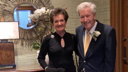 Man and woman standing and smiling