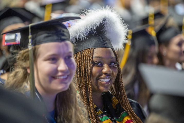 two women in graduation caps