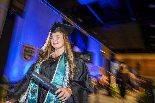 graduate walking on stage
