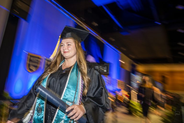 graduate walking on stage