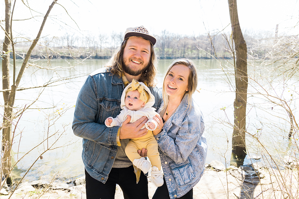 Man and woman holding a baby