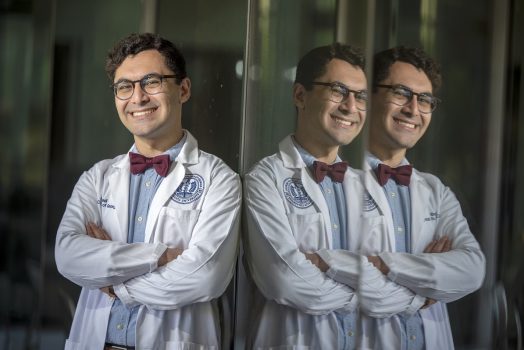 Man smiling with his reflection