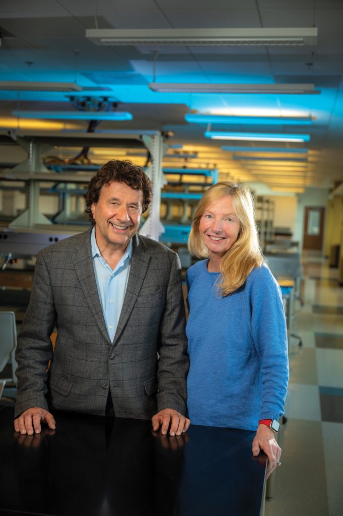 Man and woman standing in a lab.