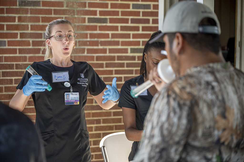 Woman demonstrating breathing