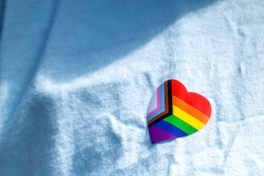 pride/rainbow sticker on a shirt
