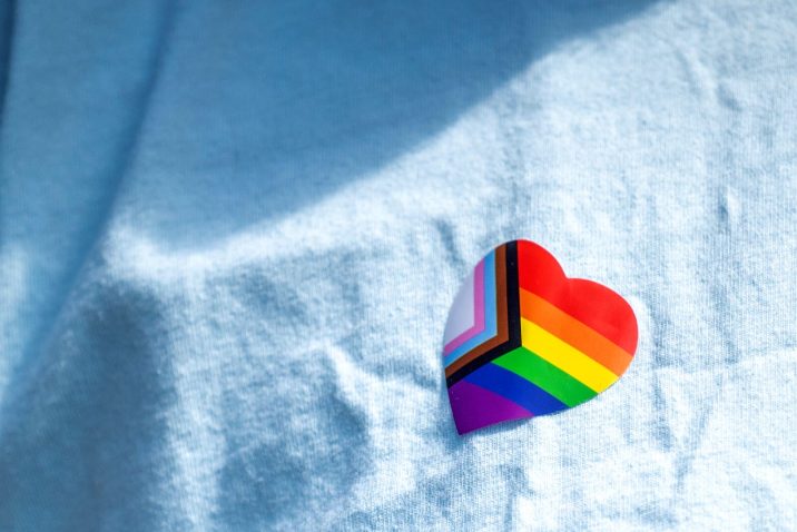pride/rainbow sticker on a shirt