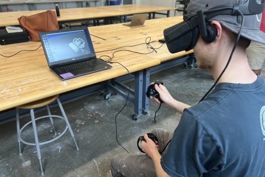 student uses virtual reality device