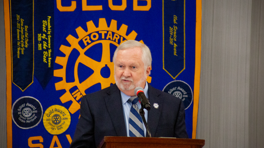 man standing at podium