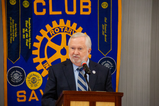 man standing at podium