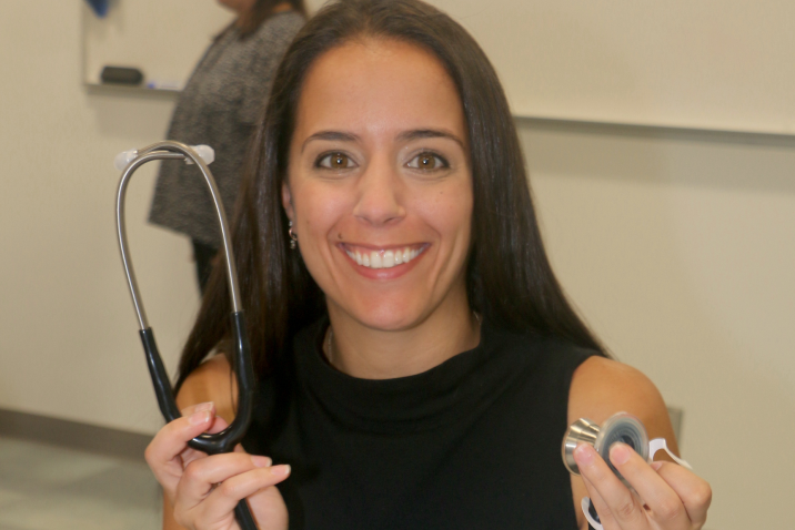 woman holding stethoscope