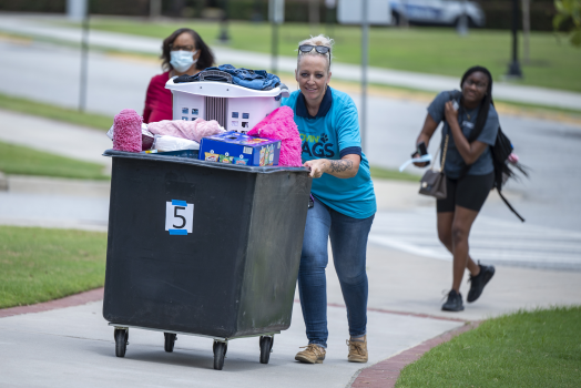volunteer pushing a cart