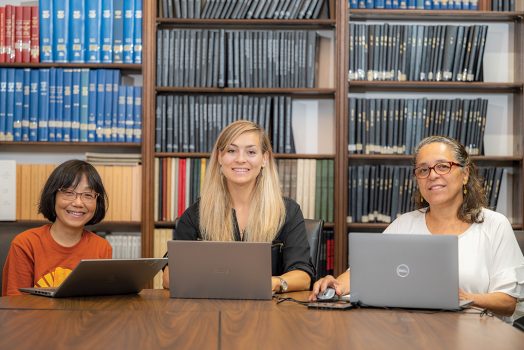 Three women smiling