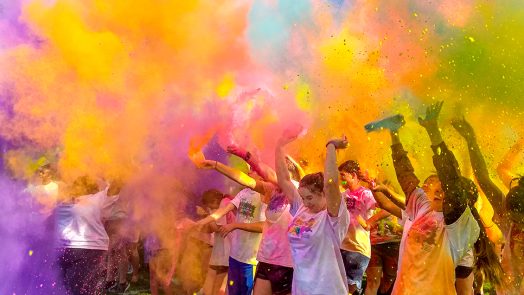 People throwing color in the air