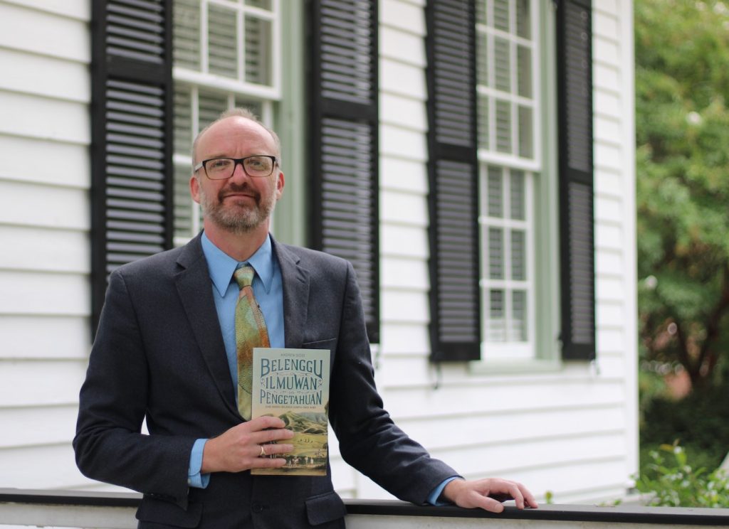 Man standing with book