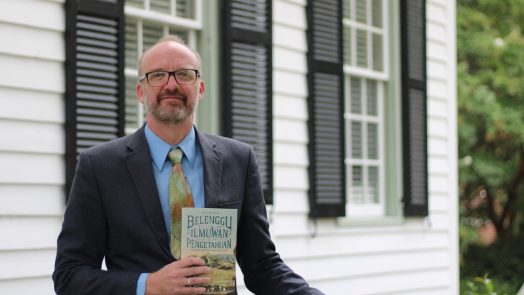 Man standing with book